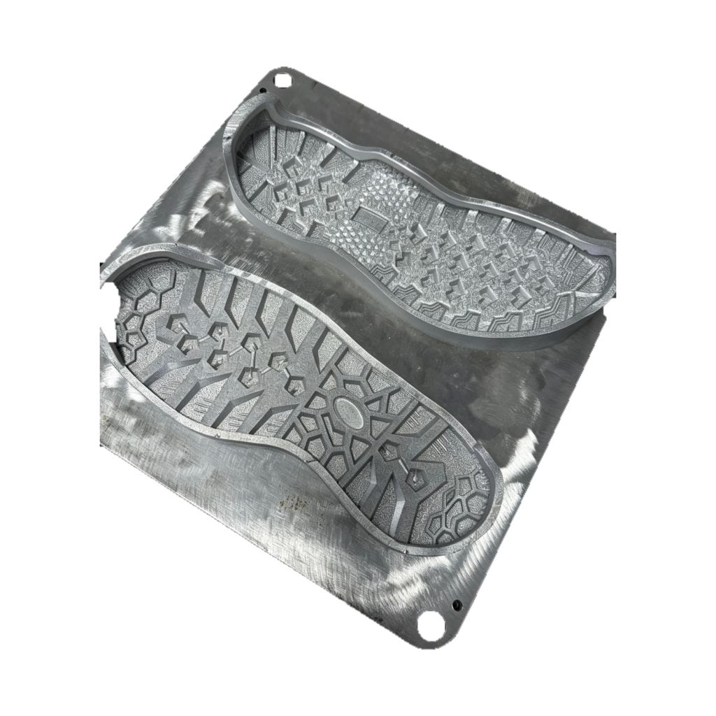 Precision metal footwear mold with complex outsole geometry for shoe manufacturing applications